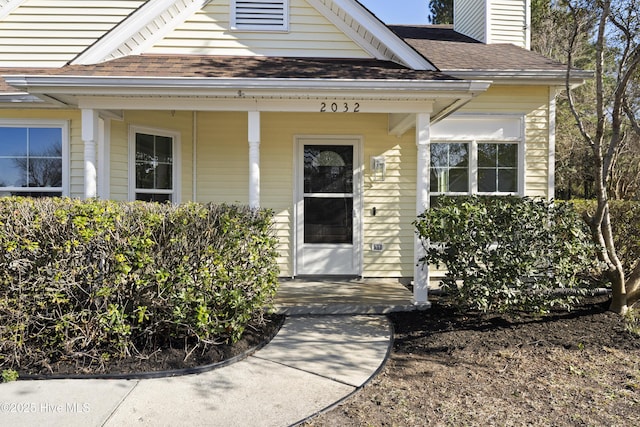 property entrance featuring covered porch