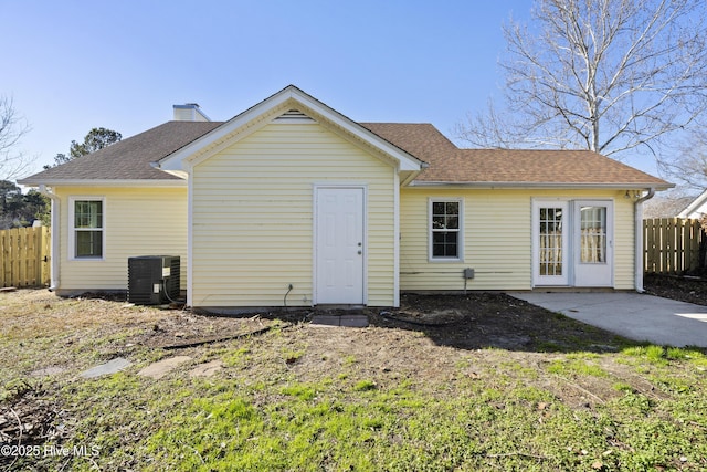 rear view of property featuring a patio and central AC unit