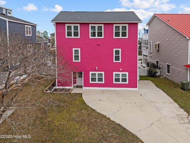 rear view of property featuring a patio