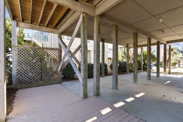 wooden terrace featuring a patio area