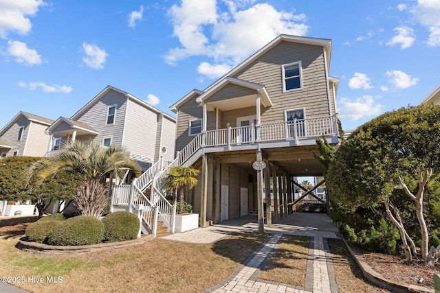 view of front of house featuring a carport and a porch