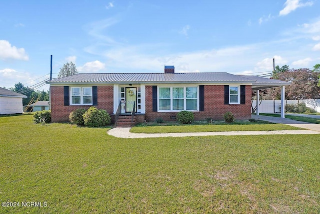 ranch-style home with a front lawn and a carport