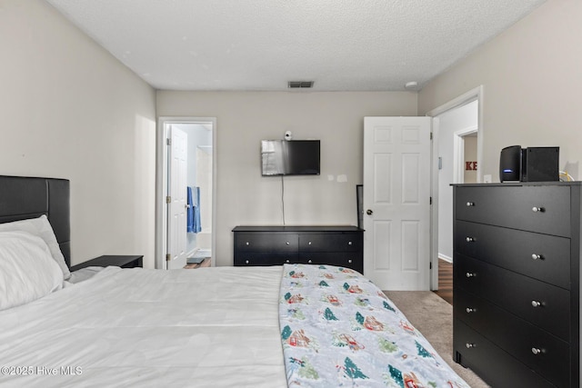 bedroom featuring a textured ceiling