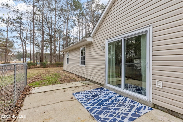 view of patio / terrace featuring fence