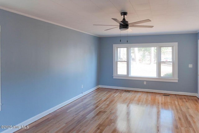 empty room featuring light wood-type flooring, ceiling fan, and ornamental molding