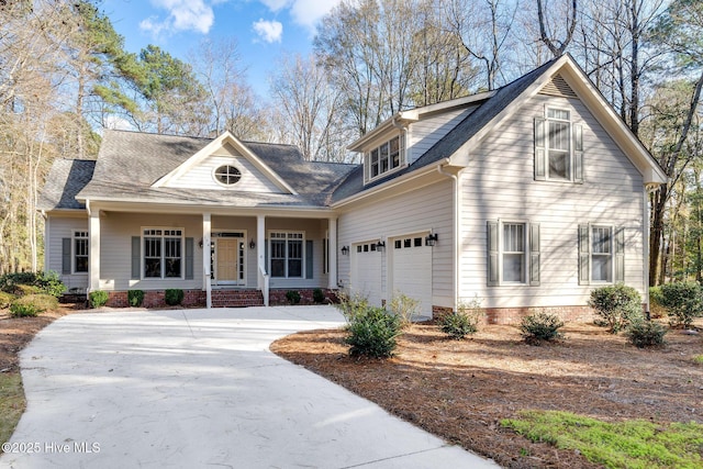 view of front of house featuring a garage and covered porch