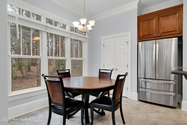 tiled dining area with ornamental molding and a chandelier