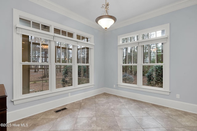 unfurnished dining area with tile patterned flooring and ornamental molding