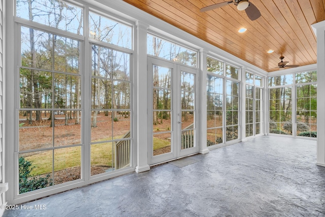 unfurnished sunroom with wooden ceiling and ceiling fan