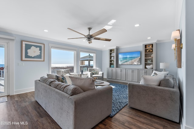 living room with ceiling fan, ornamental molding, dark hardwood / wood-style floors, and built in features