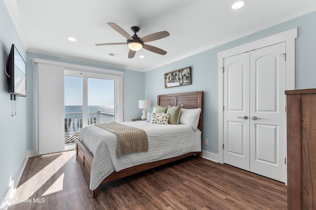 bedroom featuring crown molding, ceiling fan, access to exterior, dark hardwood / wood-style flooring, and a closet