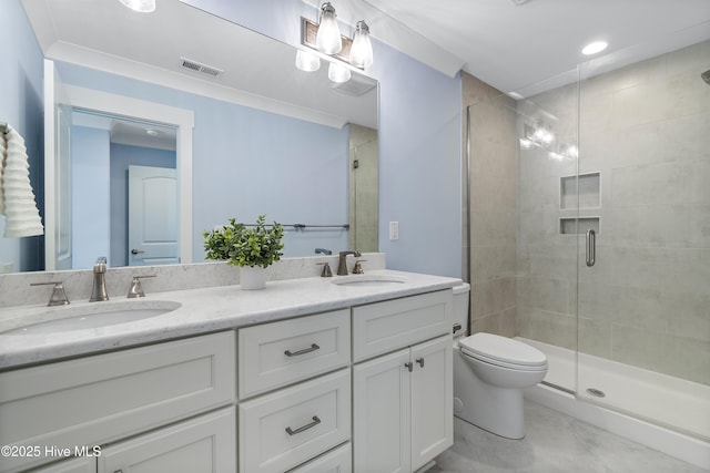 bathroom with vanity, toilet, and a shower with shower door