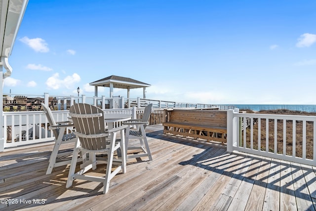 wooden terrace with a water view