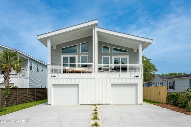 view of front of home featuring a balcony and a garage