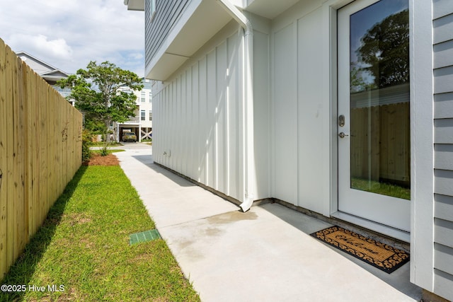 property entrance featuring a patio area