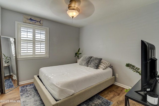 bedroom featuring ceiling fan and wood-type flooring