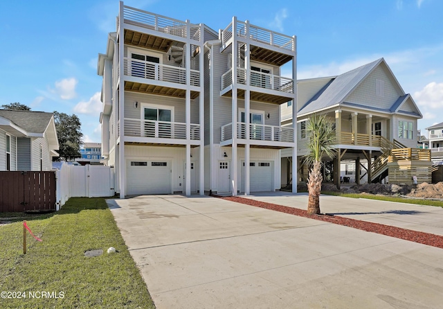 view of front facade with a garage and a front lawn