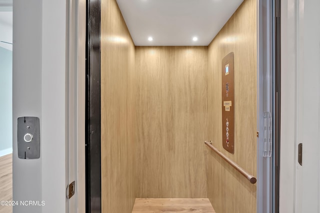 details with elevator and wood walls