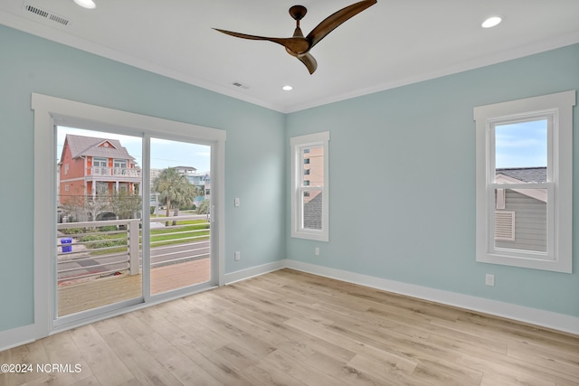 unfurnished room featuring ceiling fan, crown molding, and light wood-type flooring