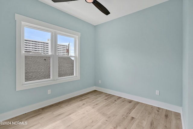 empty room featuring ceiling fan and light hardwood / wood-style floors