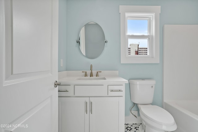 bathroom with toilet and vanity