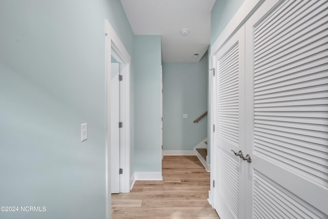 hall with light hardwood / wood-style floors