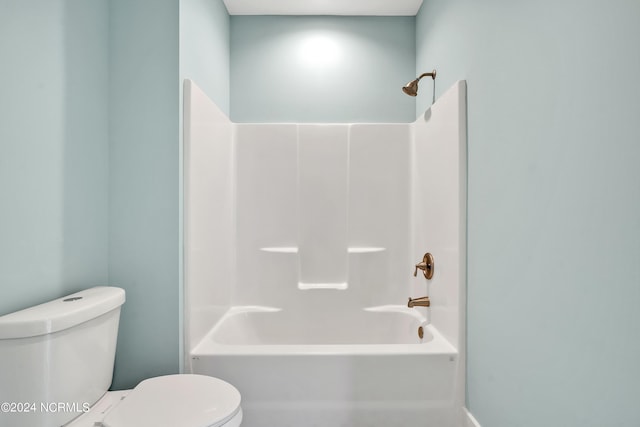 bathroom with toilet and  shower combination