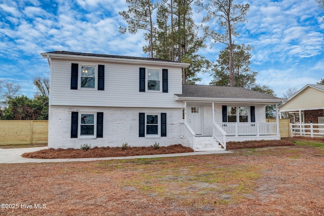 split level home featuring covered porch