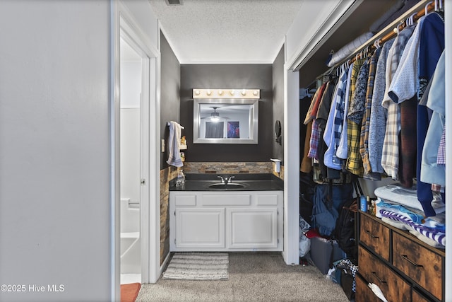 bathroom featuring vanity and a textured ceiling