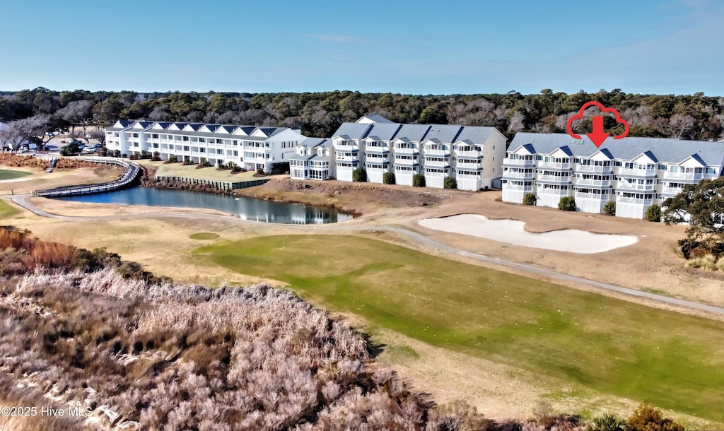 birds eye view of property featuring a water view