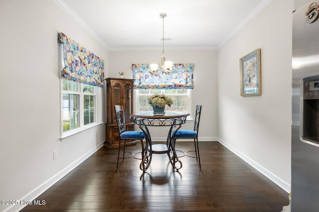 dining area featuring crown molding, dark wood-type flooring, and a notable chandelier