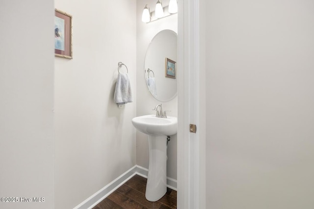 bathroom with sink and wood-type flooring