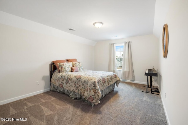 carpeted bedroom with vaulted ceiling