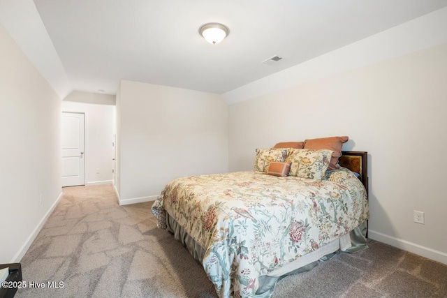 carpeted bedroom featuring vaulted ceiling