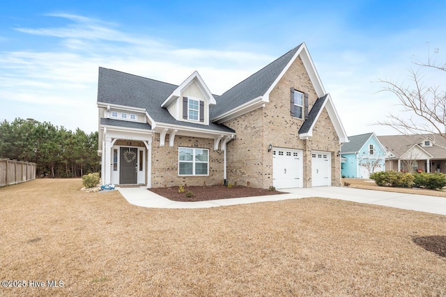 view of front of home with a garage and a front yard