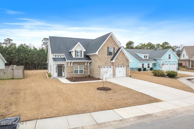 view of front of property featuring a garage and a front yard