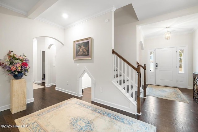 1512 Grove Ln, Wilmington, NC 28409 - foyer entrance with arched walkways, wood finished floors, baseboards, stairway, and ornamental molding