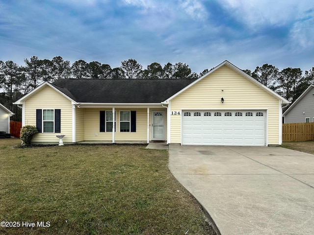 ranch-style house featuring a garage and a front lawn