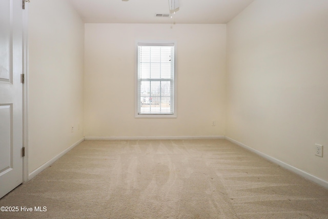 empty room featuring light colored carpet