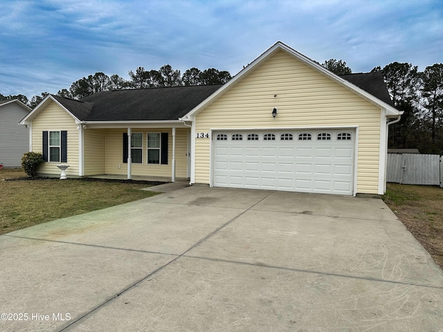 ranch-style home with a garage and a front yard