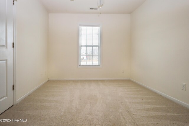 unfurnished bedroom with light carpet and ceiling fan