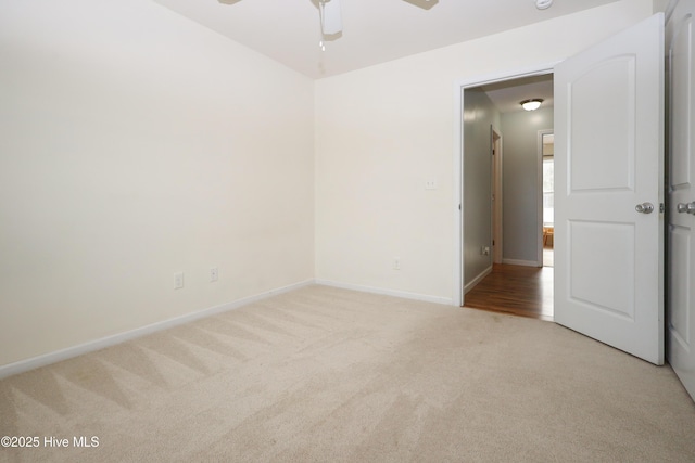 carpeted empty room with ceiling fan