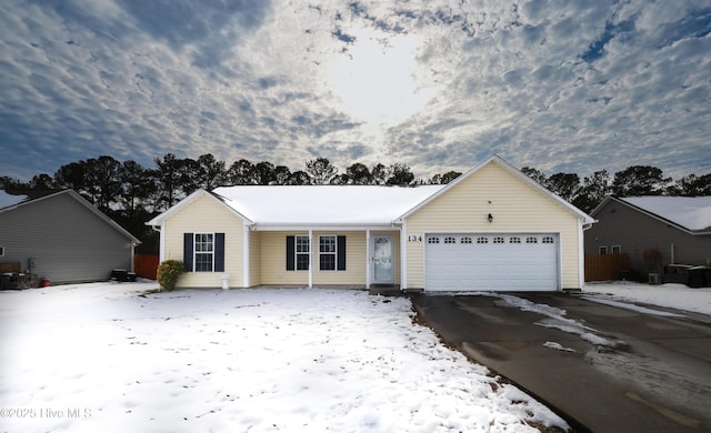 ranch-style home featuring a garage