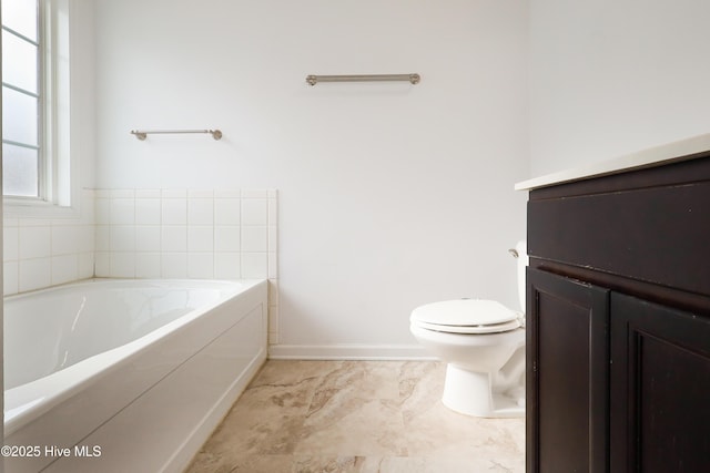 bathroom featuring a washtub and toilet