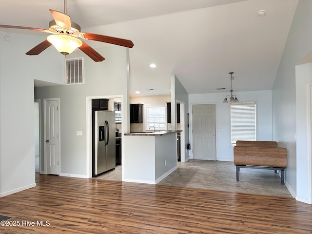 kitchen with appliances with stainless steel finishes, light wood-type flooring, visible vents, and baseboards