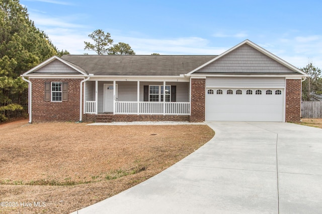 single story home with a porch and a garage