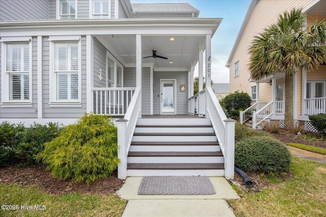 property entrance featuring ceiling fan and a porch