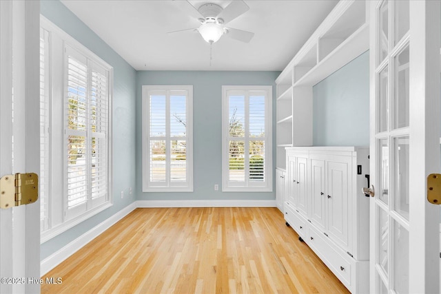 interior space with ceiling fan and a wealth of natural light