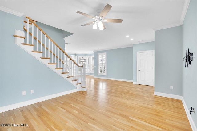 unfurnished living room with light wood-type flooring, ceiling fan, and ornamental molding