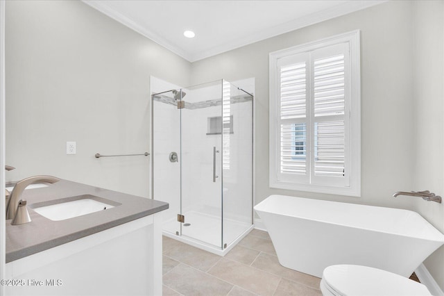 full bathroom with tile patterned flooring, vanity, toilet, crown molding, and independent shower and bath